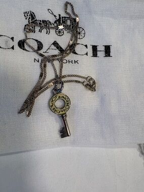 Cute Coach key with pale yellow enamel